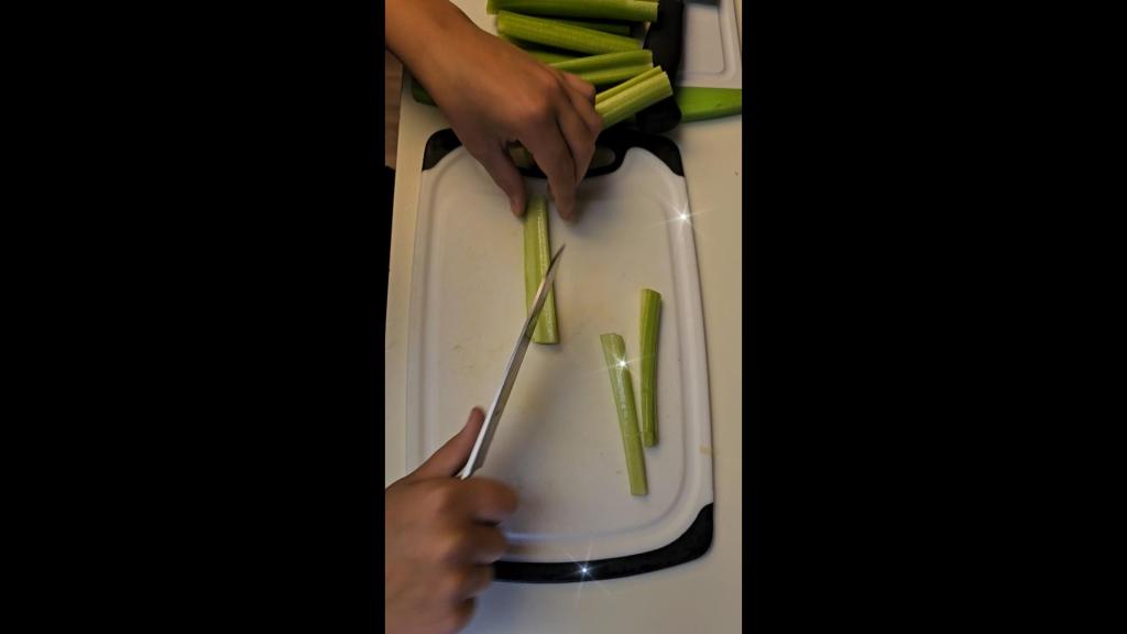 Daughter Cutting Celery